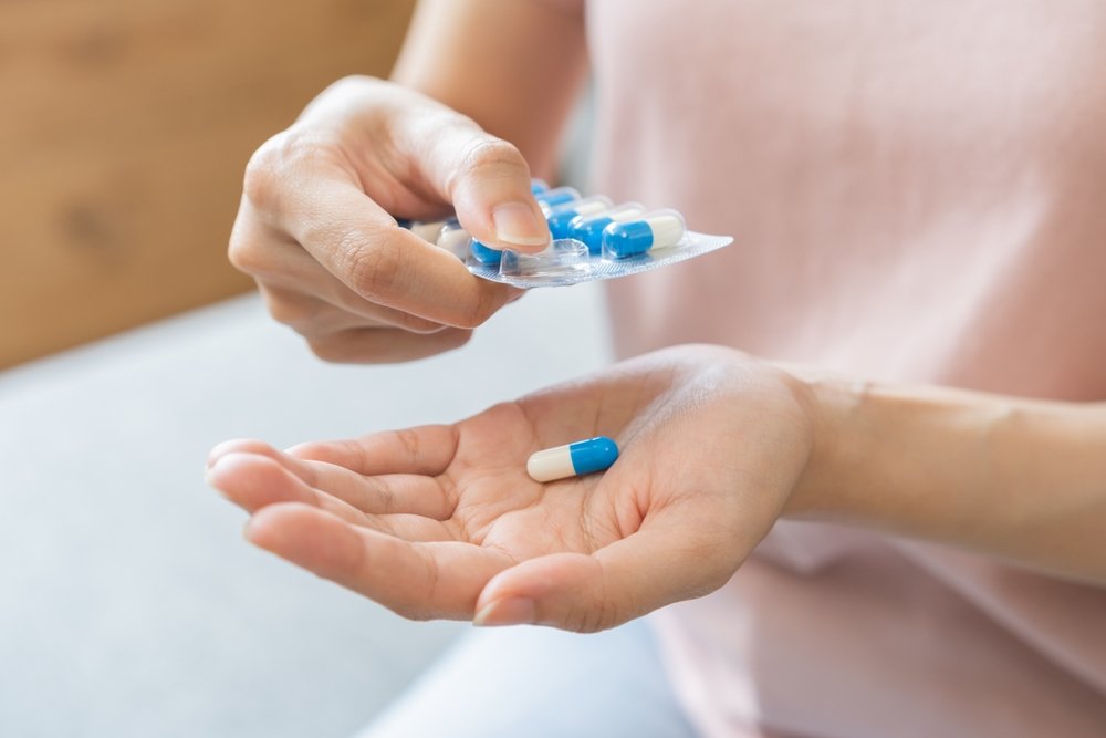 Removing Medicine From A Strip in hand